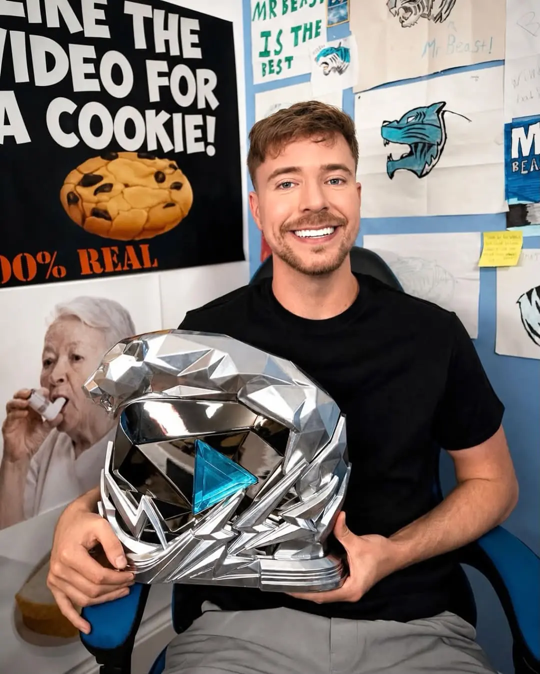 MrBeast's custom 500 million subscriber Beast Panther trophy showing the silver diamond-textured base with the 3D metallic panther and vivid blue crystal play button