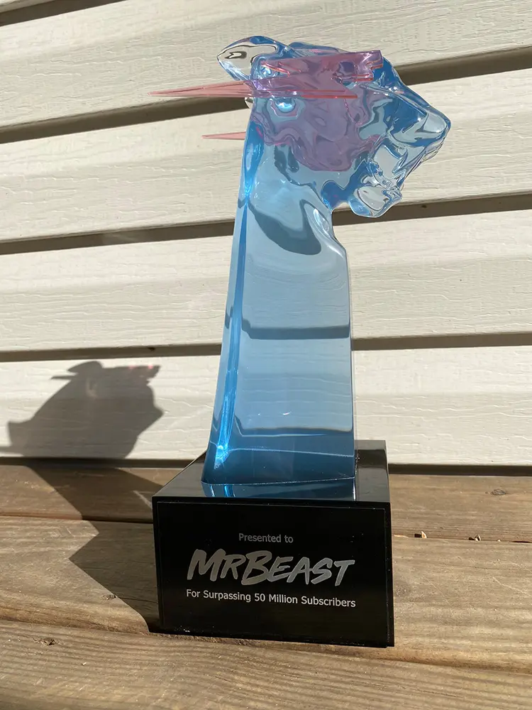 Daniel Krafft's handmade 100 pound custom 50 million subscriber play button for MrBeast made from aluminum titanium gold damascus steel and padauk wood