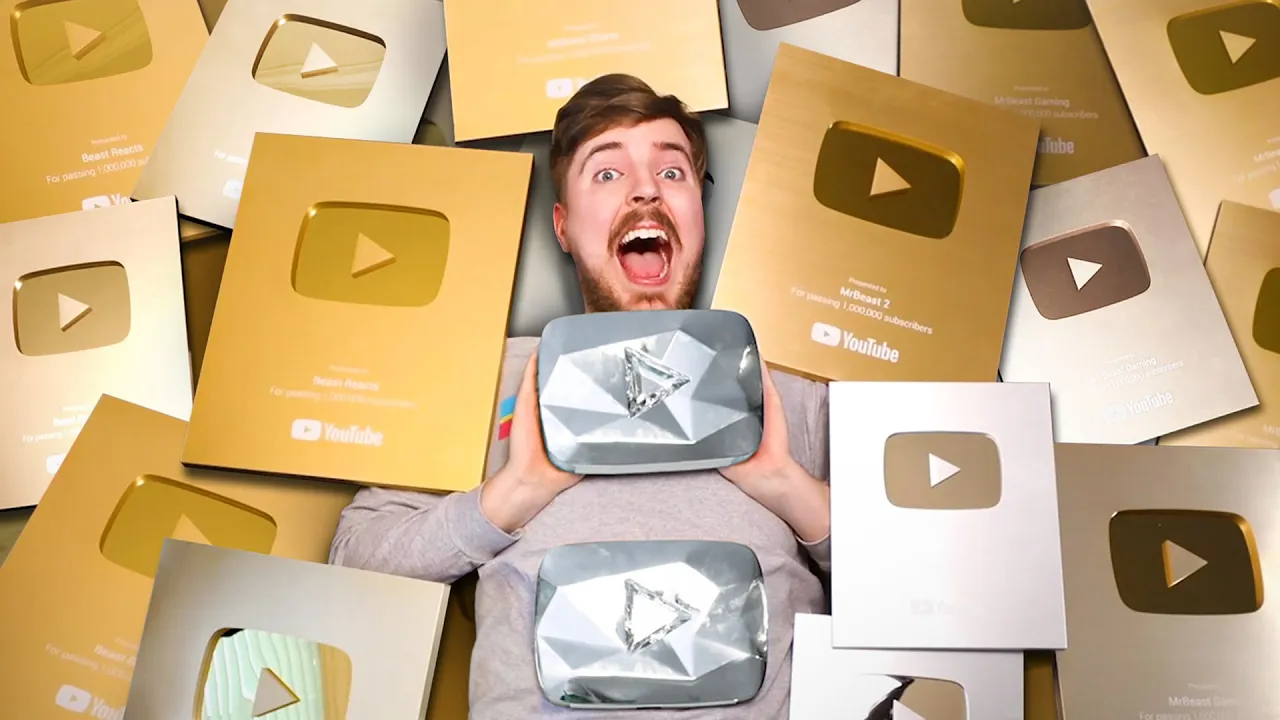 MrBeast holding the custom 500 million subscriber YouTube play button with Neal Mohan